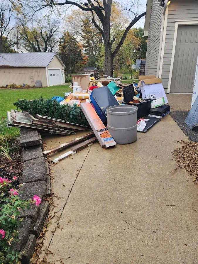 Dumpster being loaded with debris for 30 Yard Dumpster Rental in Central Point